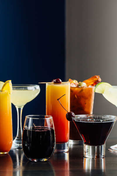 An assortment of Azalea Kitchen's cocktails, including margaritas, a tequila sunrise, and a Bloody Mary.