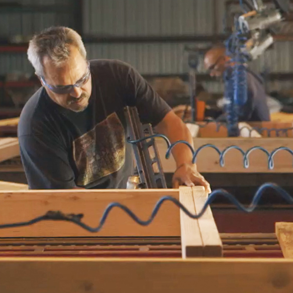 Man constructing framing for a building