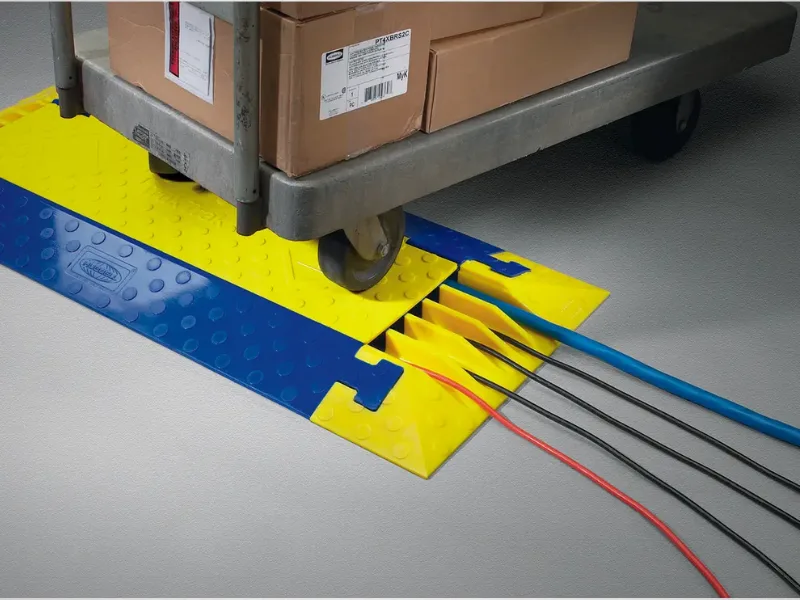 HUBS-CA - TrukTrak - Image Floor cable cover with wires going through