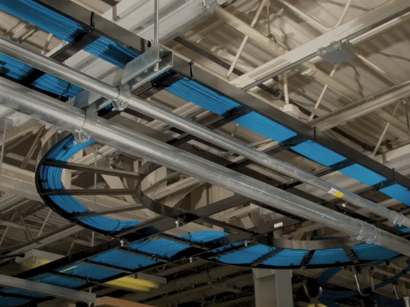 HUBS-CA - NextFrame Ladder Rack - Image Ladder racks on ceiling holding wires