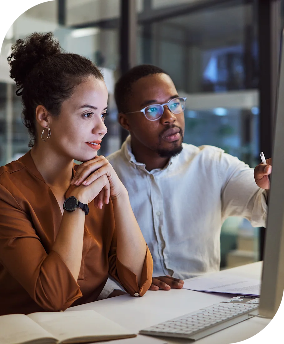 man and woman looking at a computer screen