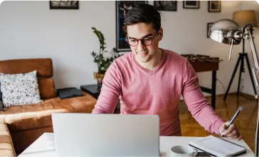 An image of a man working on his laptop.