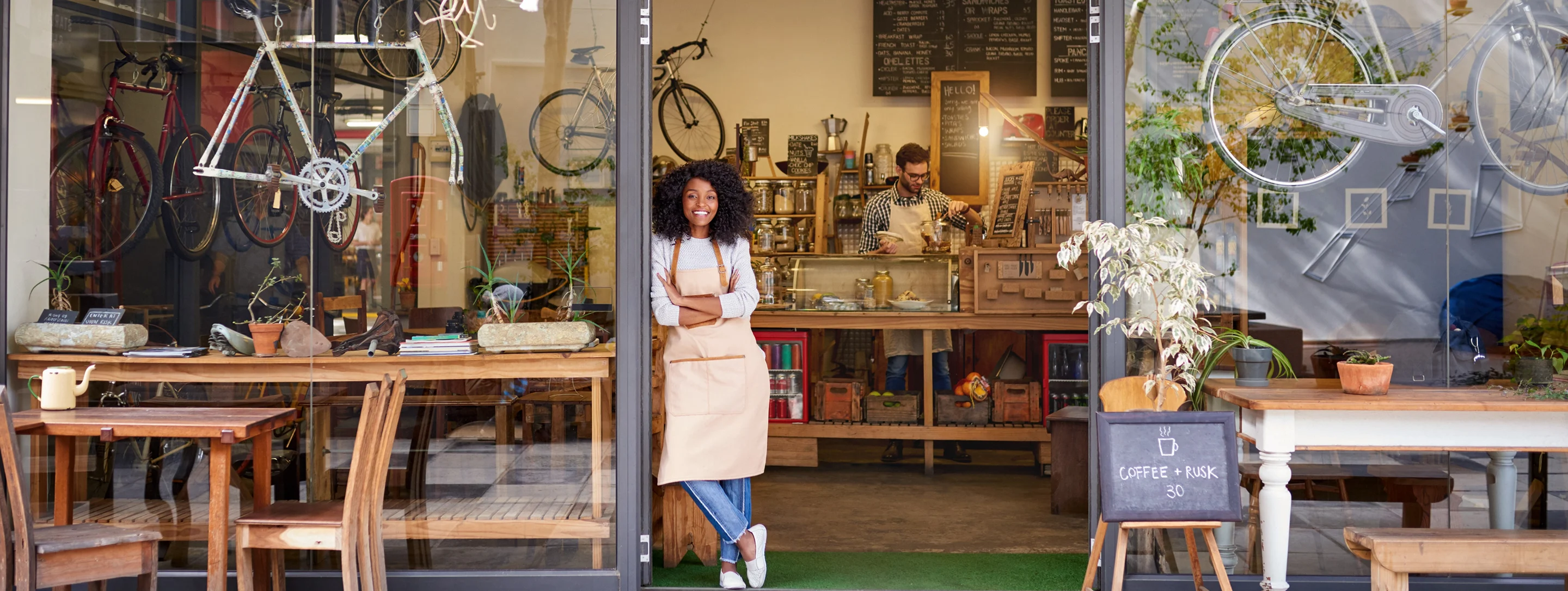 woman leaning at the shop door