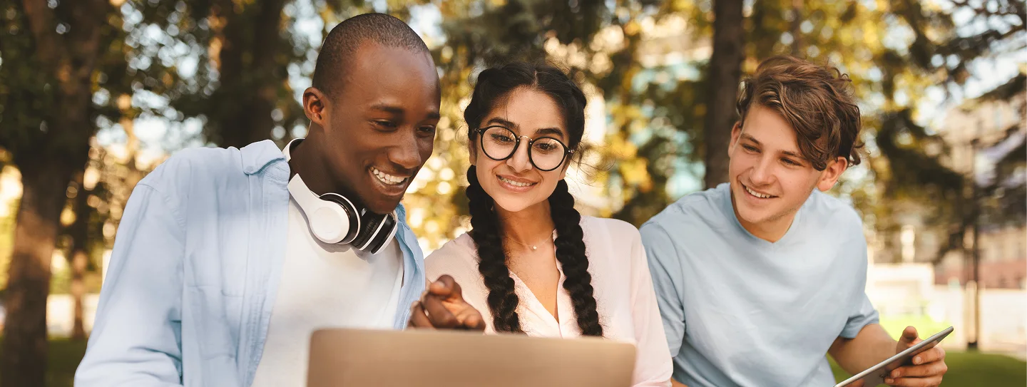 Group of student looking at laptop