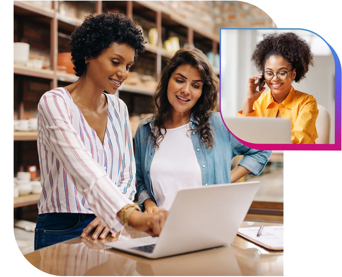 two women discussing issue on laptop while consulting expert