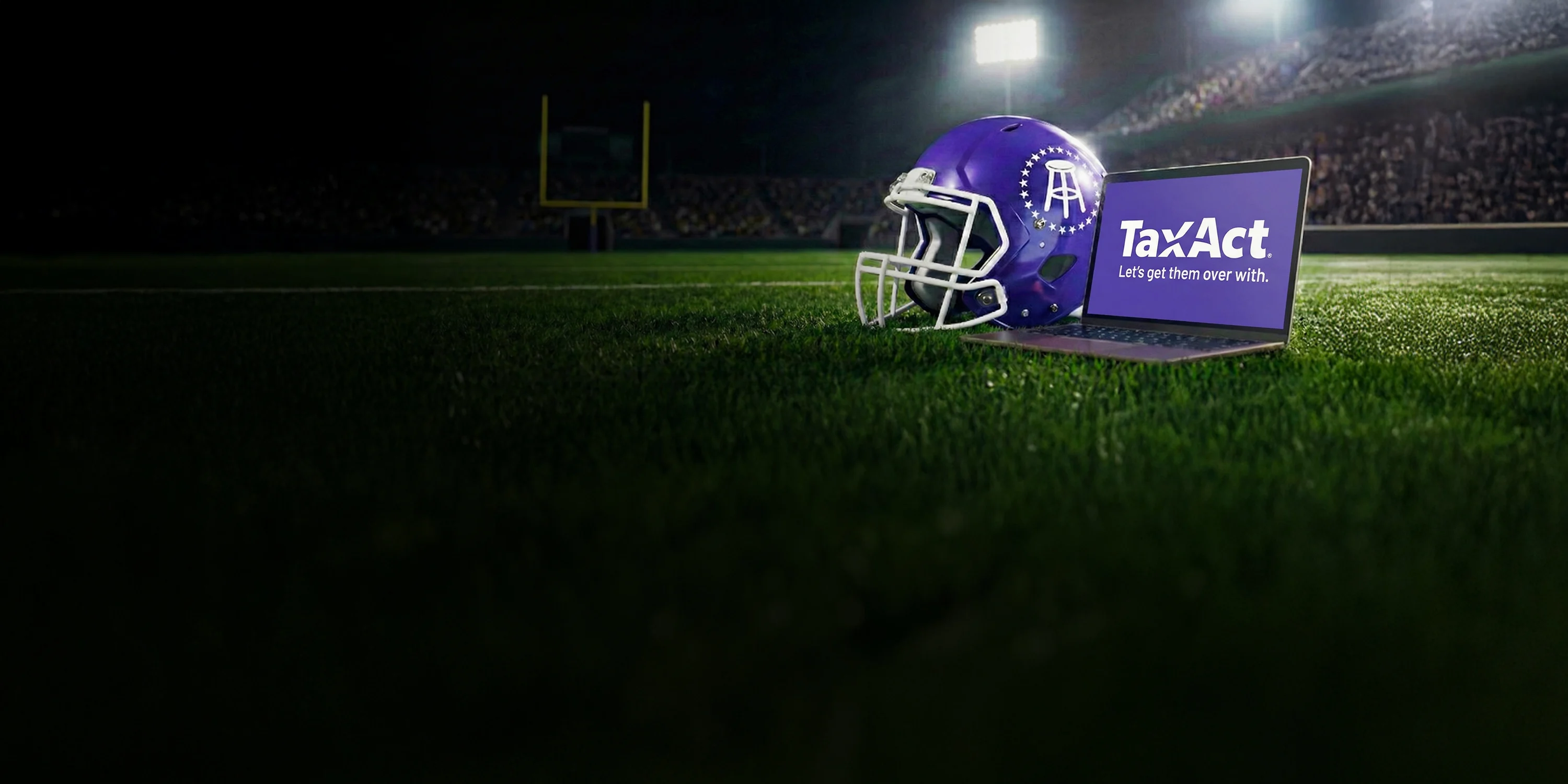 Football field with helmet and laptop