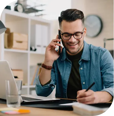 Man on the phone with laptop