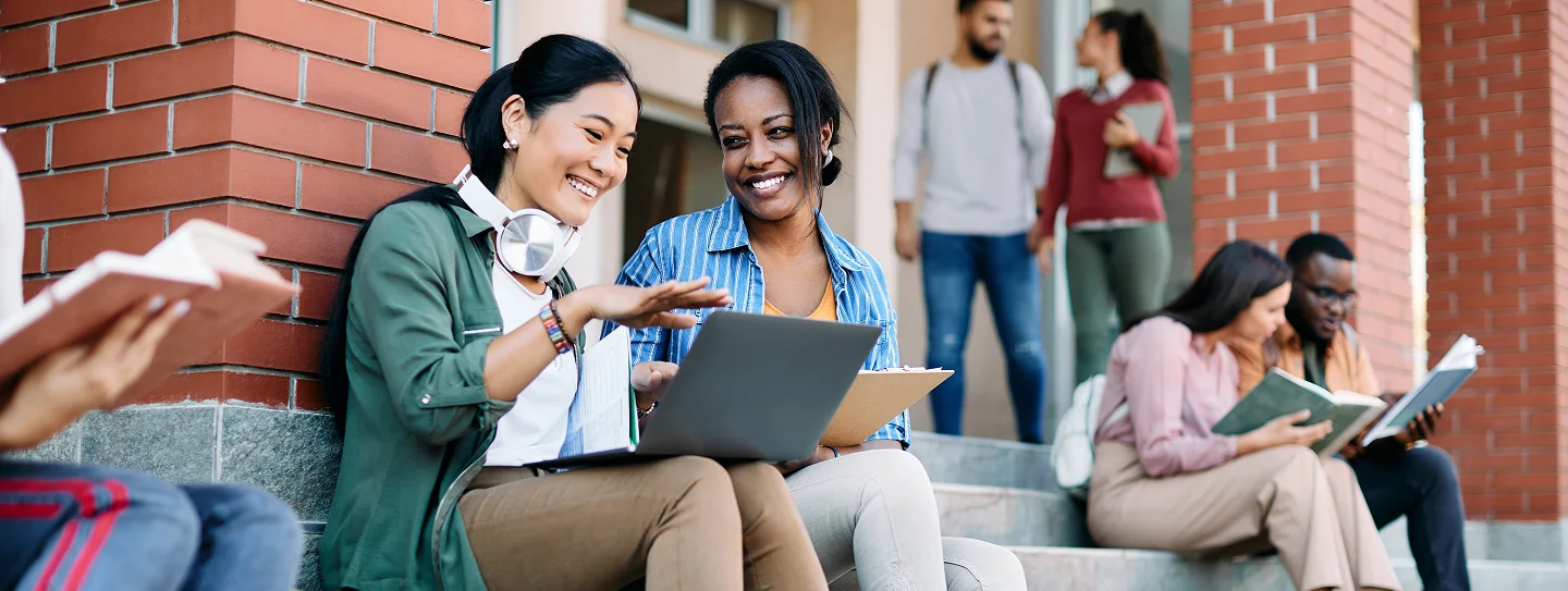 Group of student looking at laptop