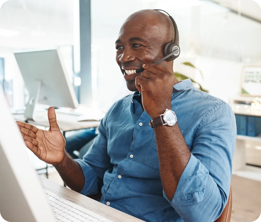 man consulting and speaking though headphones