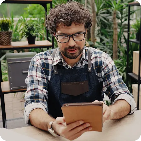 shop owner writing on notebook