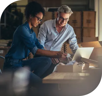 Image of two professional working on laptop