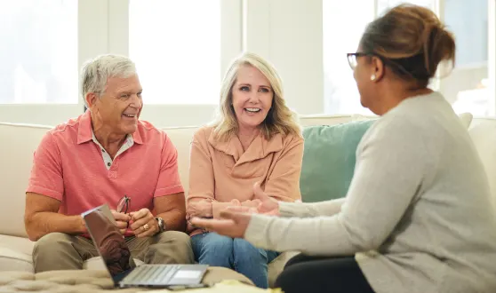 An old couple engaged in a discussion with a tax expert