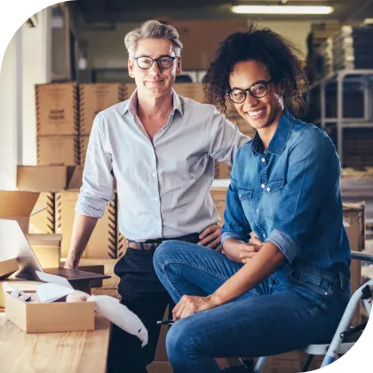 Trusted filing with guaranteed accuracy image two men smiling in warehouse