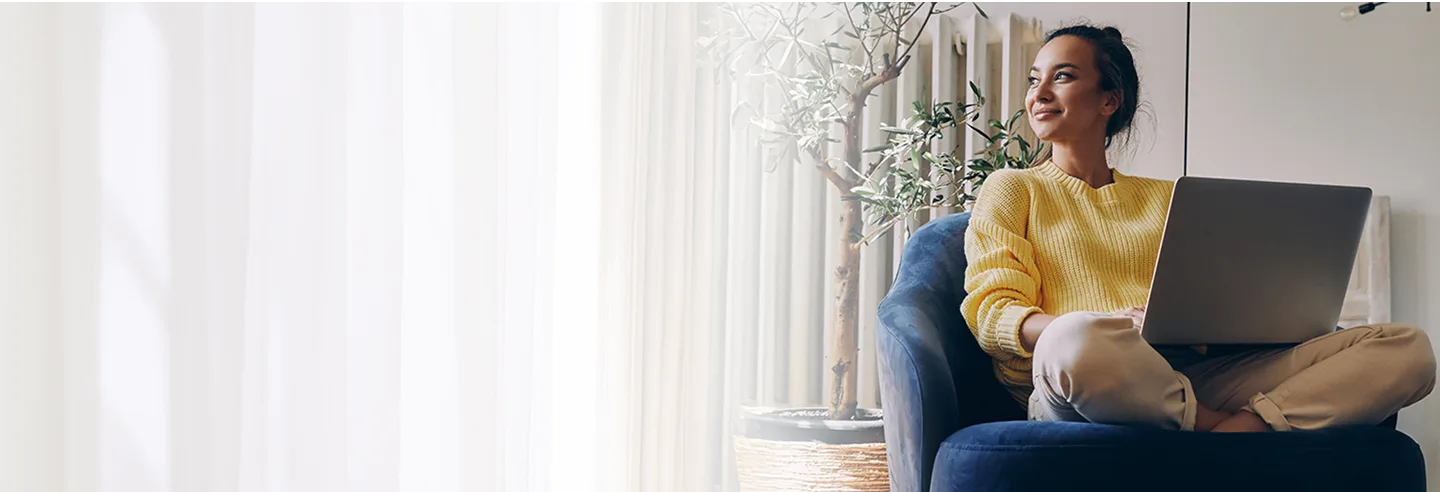 girl working on laptop smiling