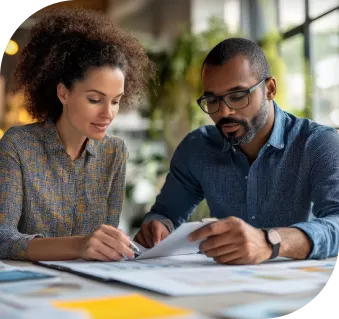 man and woman working on some paperwork