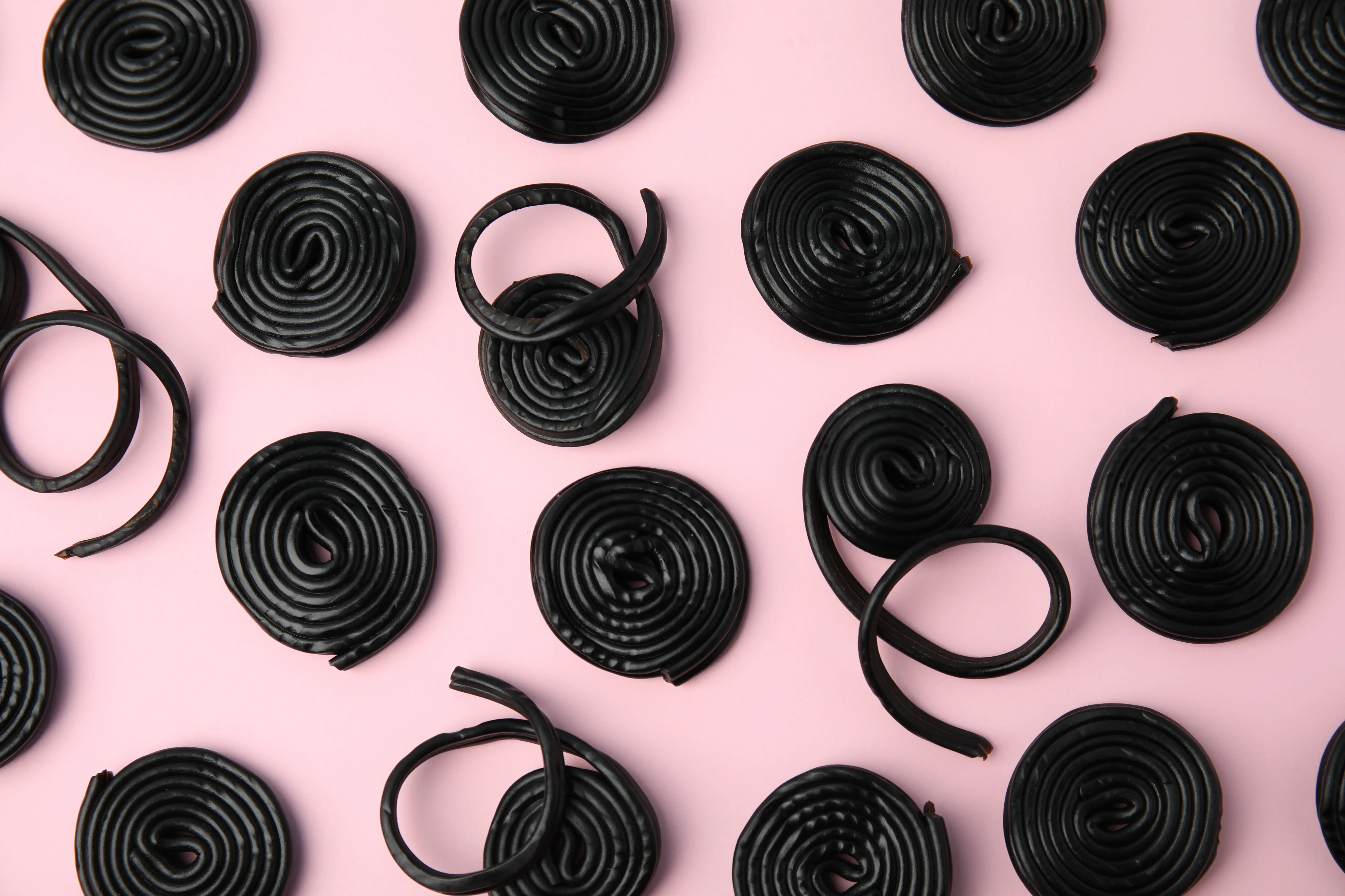 Coiled Black Licorice Swirls on Pink
