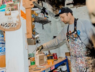 Stu Smith holding the strap of the Stockwell III in Cream