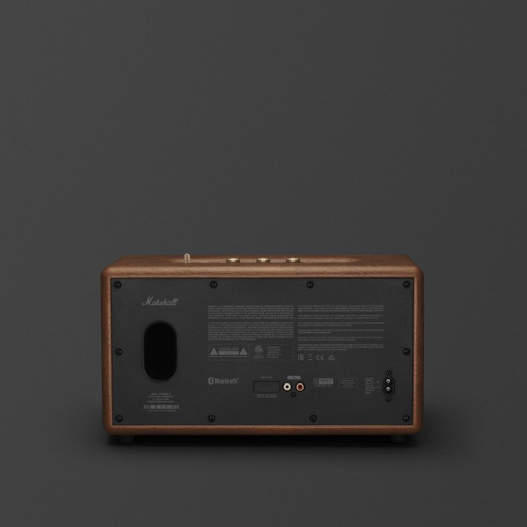 A small brown Marshall Stanmore III home speaker on a grey background.