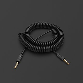 A pitch black coiled Marshall speaker audio cable on a black surface.