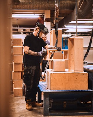 A person working on an amp in the Marshall factory