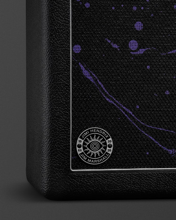 Close-up of a JMH 2x12 Cab corner, featuring a woven grille cloth with a purple abstract pattern and a round badge reading "Jimi Hendrix/Jim Marshall/1966/2026".