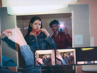 Two individuals wearing Marshall wireless earbuds sit on stone steps.