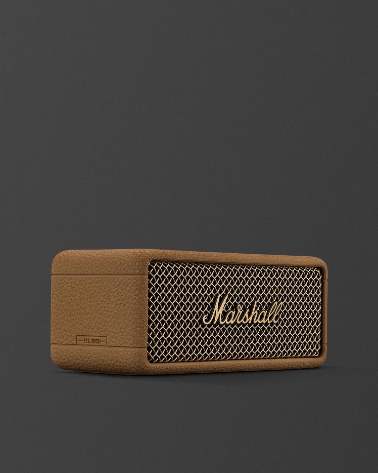 A Marshall Emberton III Brown portable speaker with a mesh front grille and the Marshall logo, placed against a plain dark background.