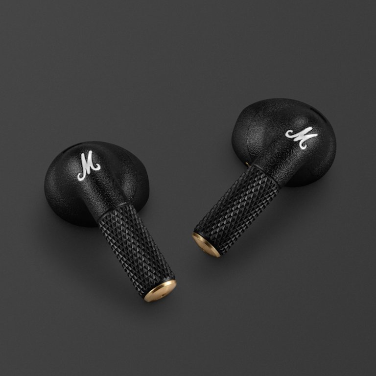 Minor IV Earbuds laying on a dark backround.