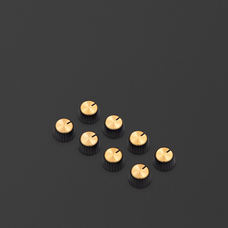 These knobs feature a black body, gold cap, and have a D-shaped push on profile.