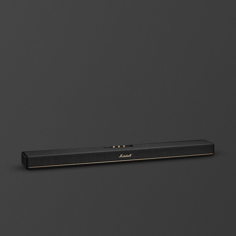 The Marshall Heston 120 soundbar, featuring a sleek black design with gold accents, stands out against a dark grey background.