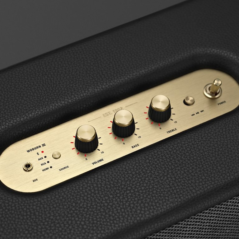 A close up of a black Marshall WOBURN III BLACK amp with gold knobs.