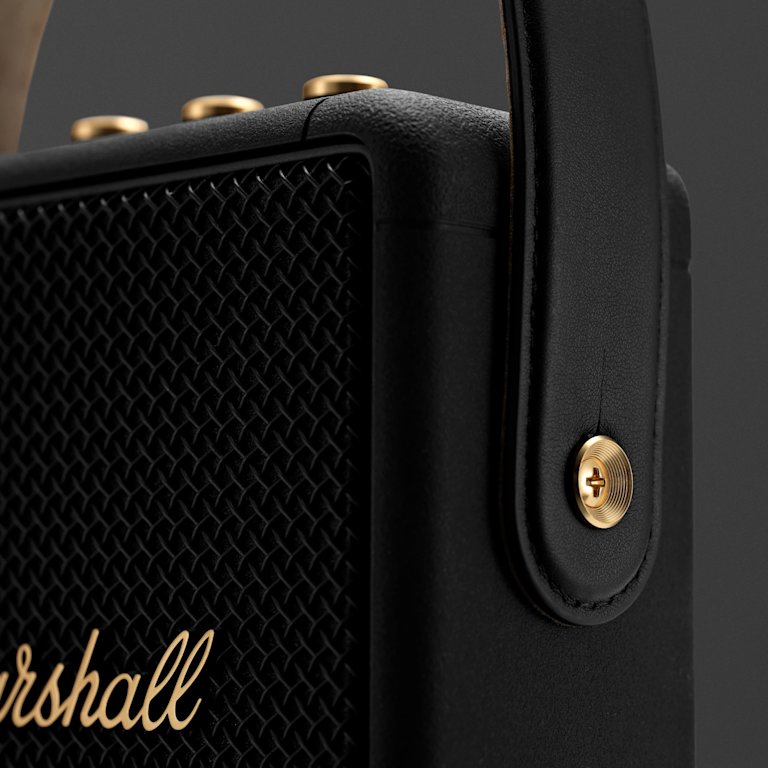 Focus on the strap detail on the side of the Marshall Stockwell II Black and Brass Speaker