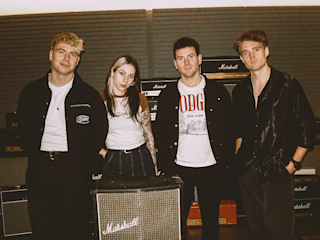 The band Daytime TV standing in front of Marshall amps