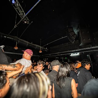 A full crowd inside a small venue