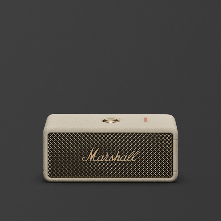 Marshall Emberton III Cream bluetooth speaker, featuring a gold grille and top buttons displayed against a dark background.