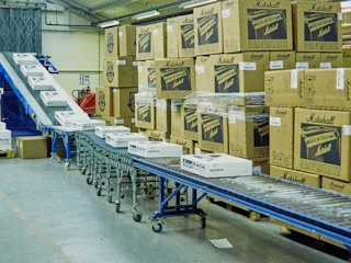 Inside a factory where products are being rolled out on a conveyor belt