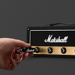 A person connecting a keychain to the Jack Rack JCM800 Reissue