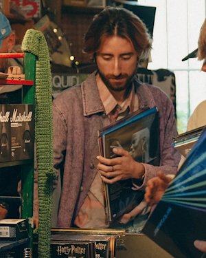 People looking at vinyls in store