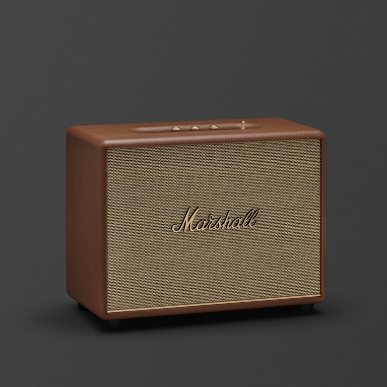 Marshall Woburn III Brown features a textured grill and gold controls on top, displayed against a dark background.