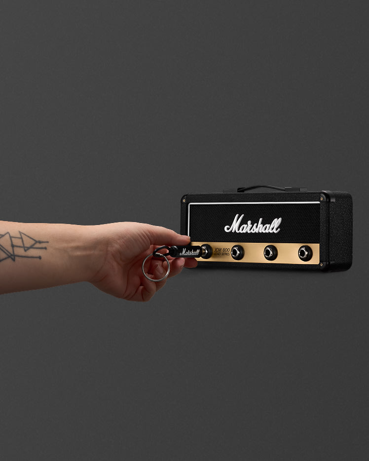A hand inserts a keychain into a Jack Rack JCM800: Reissue.