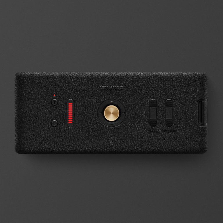 Marshall Middleton II Black and Brass, a stylish black rectangular Bluetooth speaker with a gold button, red indicator, two sliders, and USB port, is shown on a dark background.