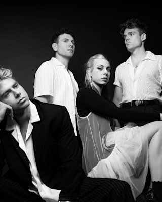 The band Daytime TV posing in a black-and-white image