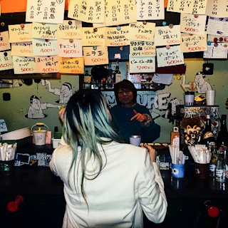 Gliiico ordering food in Tokyo
