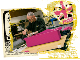 A worker building a pink amp in a factory in the UK