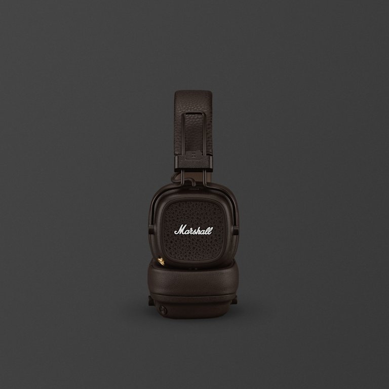 A pair of Marshall Major V Brown on-ear headphones with a textured headband against a dark background.
