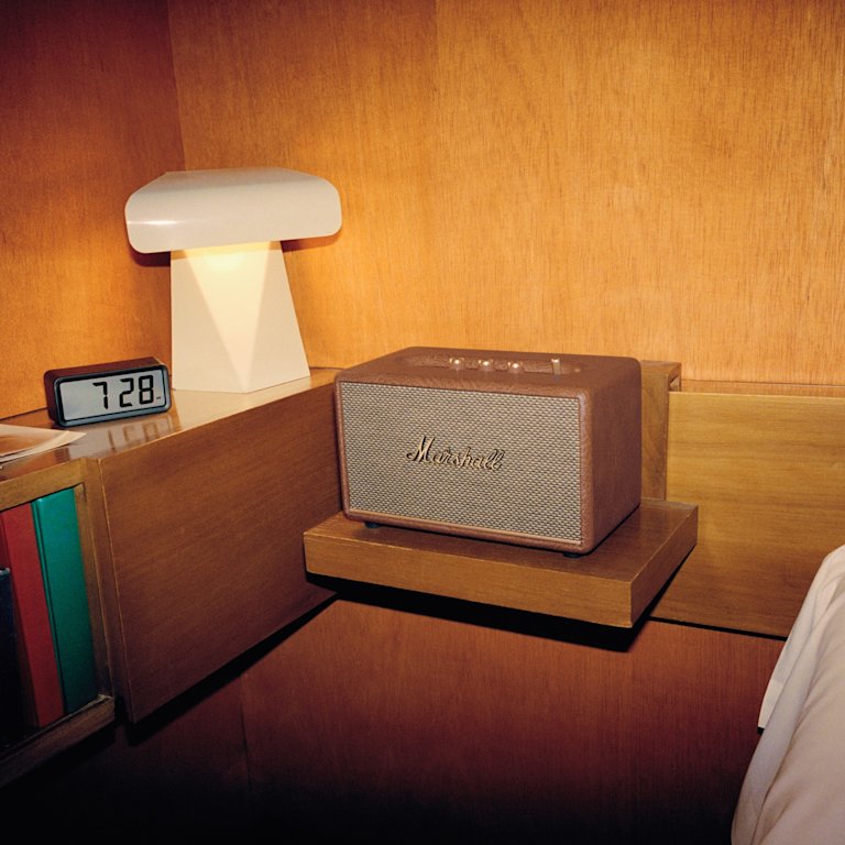 A wooden shelf with a Marshall ACTON III BROWN speaker.