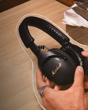 Monitor III A.N.C in black being held by a person