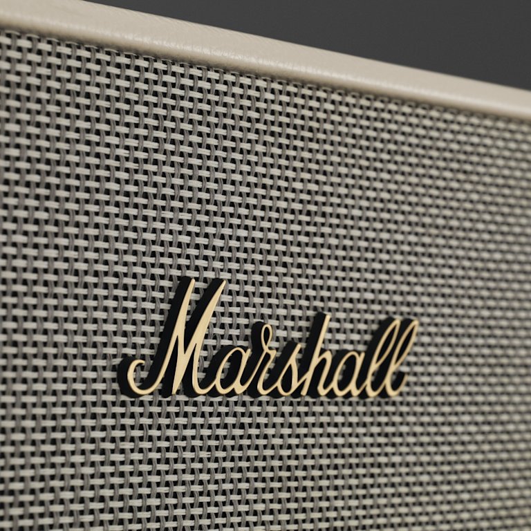 A close up of a Marshall ACTON III CREAM speaker with the word Marshall on it.