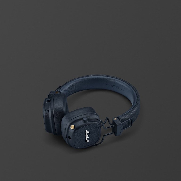 Midnight Blue Marshall Major V over-ear Bluetooth headphones are folded neatly and placed on a plain dark gray background.