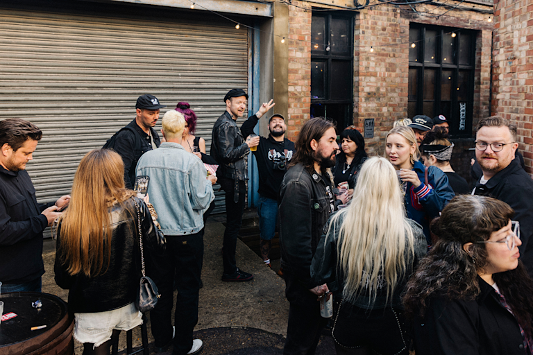 A group of people hanging out outdoors